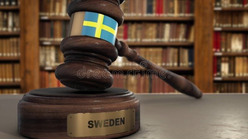 Domarklubba med svensk flagga och texten SWEDEN framför lagböcker